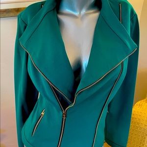 Carries Emerald Green Jacket.
